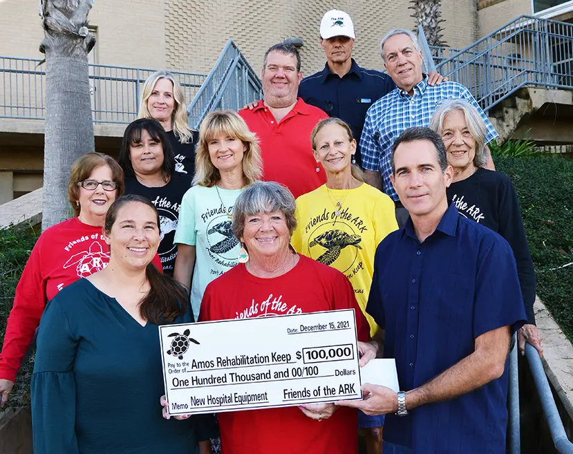 A big check is presented to the ARK